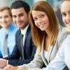 Closeup of five business school sudents smiling in front of camera